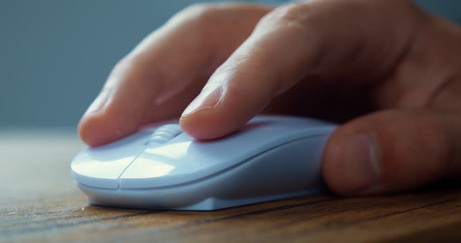 Male student click white computer mouse and scroll internet websites studying online searching information on work desk. Close up of male hand using computer mouse to working at laptop computer Royalty-Free Stock Footage #1098902077