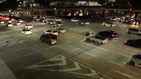 NAGOYA, JAPAN : Aerial high angle view of street traffic at night. Time lapse shot of many car at the busy road crossing. Japanese transportation and infrastructure concept video.