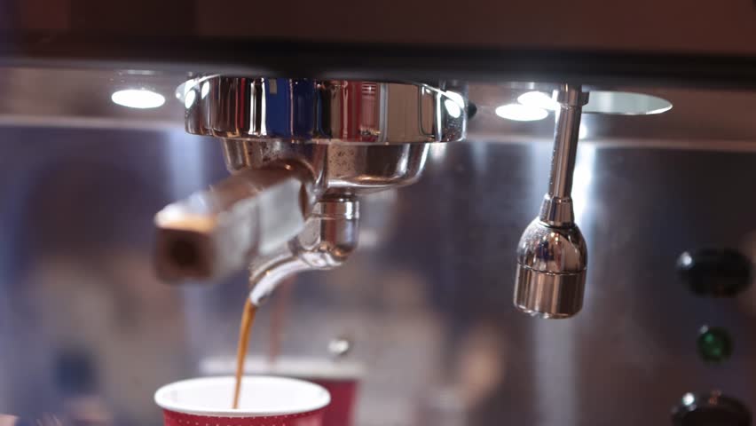 Espresso is poured into a small cardboard cup | Shutterstock HD Video #1098908711