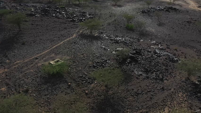 Desert kenya, africa landscape reveal of mountains and small town