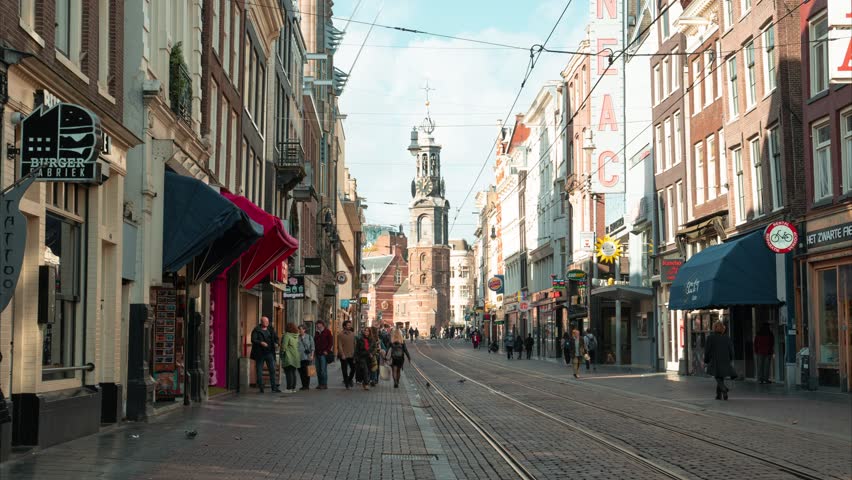 4k Time Lapse of Busy day in Amsterdam City Centre with street filled with Tourists, Rembrandtplein, Netherlands