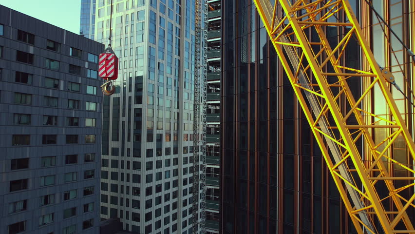 Pullback Shot Of Huge Yellow Crane Near Brooklyn Tower Under Construction, NYC