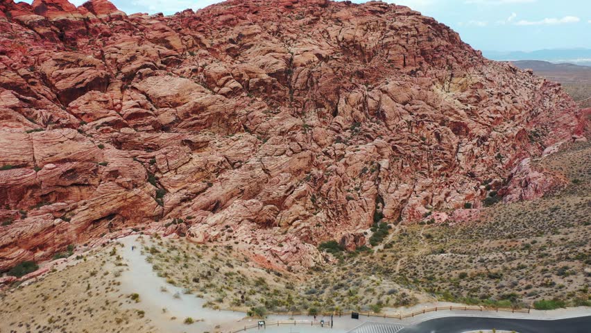 Cinematic Drone Shot of the Grand Rock Formations and Peaceful Valleys at Red Rock Canyon National Conservation Area, Nevada. Red Sandstone Cliffs in the Heart of the Mojave Desert. 4K UHD