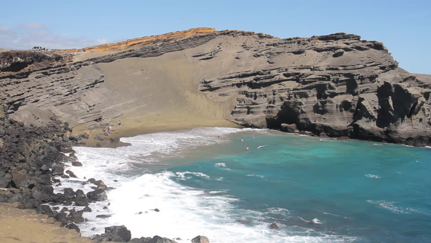 Waves Crash Against Shore on Green Sand Beach in Hawaii
