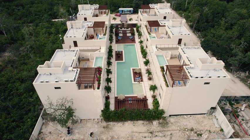 Drone shot of a luxury hotel with beautiful modern architecture in Tulum, Mexico. | Shutterstock HD Video #1098921741
