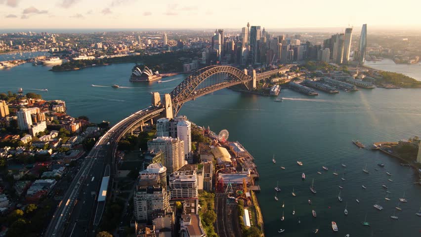 Aerial drone view of Sydney City and Sydney Harbour showing Sydney Harbour Bridge and Lavender Bay in the late afternoon        Royalty-Free Stock Footage #1098928061