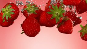 Super slow motion of falling strawberries into water on red background. Filmed on high speed cinema camera, 1000 fps.  - Powered by Shutterstock - Get 15% off with code: PIKWIZARD15