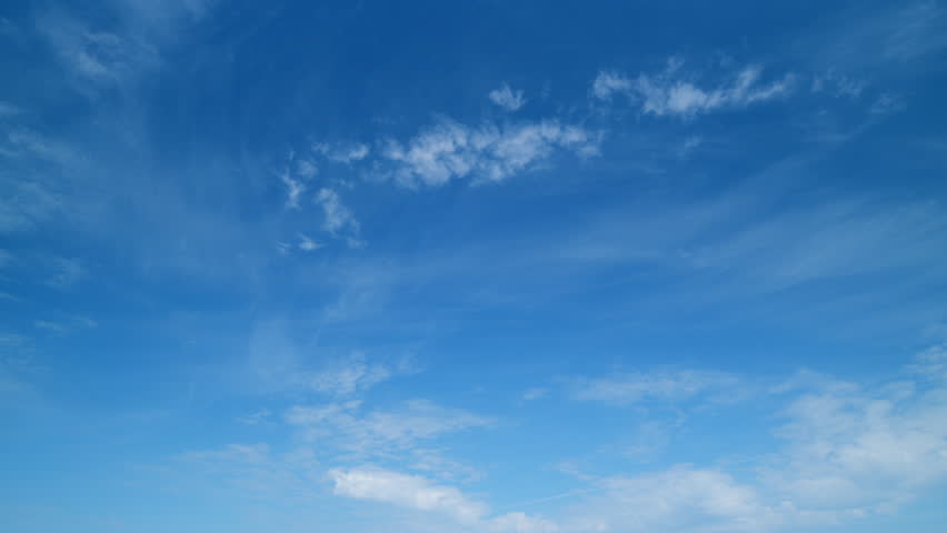 Flying moving white clouds in a blue sky. Blue sky background with many layers tiny clouds. Timelapse. Royalty-Free Stock Footage #1098931057