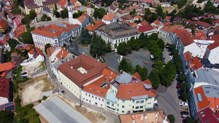 Veszprem, Hungary - 4K flying over the medieval district of Veszprem Ovaros square on a bright summer day with clear blue sky	