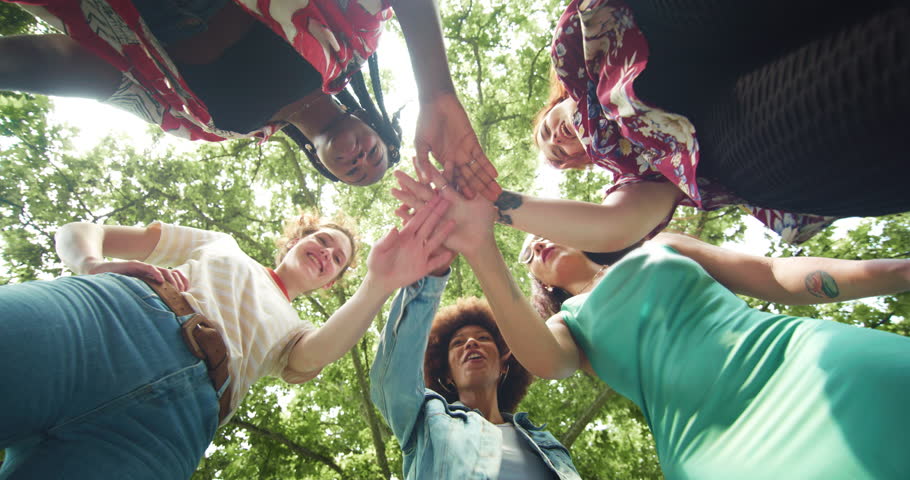 Diverse Group of Female Friends Stacking Their Hands Together as a Team and Ending with a Cheer. Multiethnic Girls Gathered in a Huddle to Motivate Eachother and Make a Plan | Shutterstock HD Video #1098931561