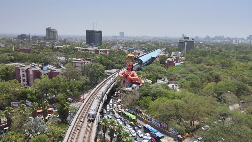 An Aerial Shot of Hanuman statue and Delhi Metro at Jhandewalah, New Delhi,India

