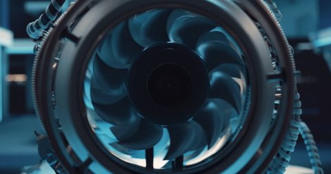 Industrial High Tech Sustainable Electric Turbine Motor in a Factory Workshop. Tech Facility with Servers, Computers and Research Equipment. Zoom Out Footage From Inside the Engine with Spinning Fan, videoclip de stoc