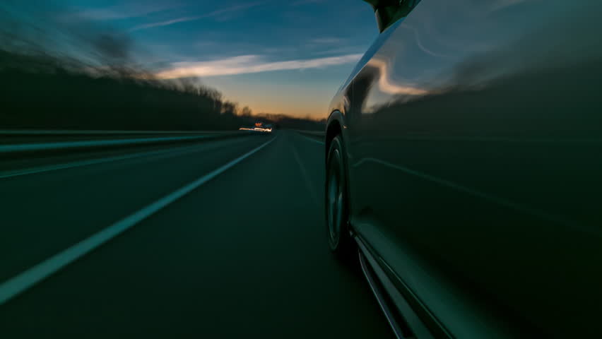 timelapse Driving at high speed through the streets timelapse drivelapse hyperlapse. View from side of car with slider movement at sunset on city road Royalty-Free Stock Footage #1098935195