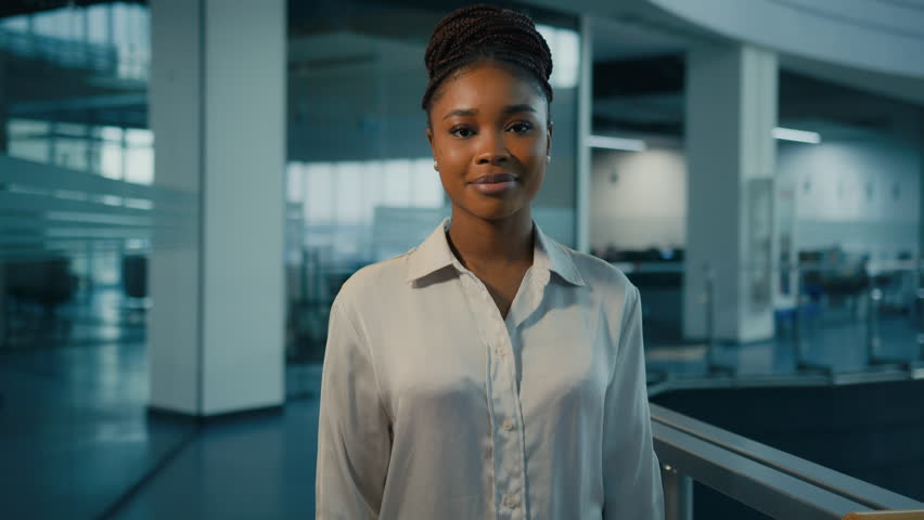 African American ethnic millennial 30s successful confident strong businesswoman in office. Woman corporate worker feminism lady female leader multiracial company CEO crossing arms looking at camera Royalty-Free Stock Footage #1098938553