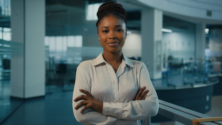 African American ethnic millennial 30s successful confident strong businesswoman in office. Woman corporate worker feminism lady female leader multiracial company CEO crossing arms looking at camera | Shutterstock HD Video #1098938553