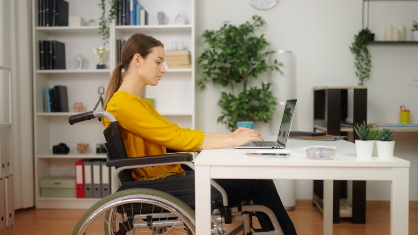 Young woman with disability working as a freelancer, modern businesswoman | Shutterstock HD Video #1098938895