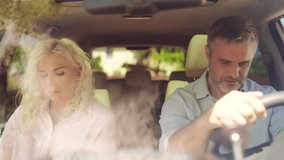 Middle-aged couple having a fight in a car, stress, problems in a relationship - Powered by Shutterstock - Get 15% off with code: PIKWIZARD15