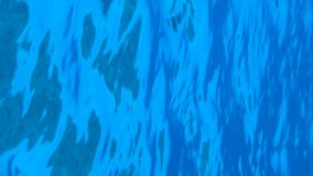 VERTICAL VIDEO, Underwater view on calm surface of blue water. Natural background with surface of blue water. Texture of blue water on surface. Close-up, Slow Motion