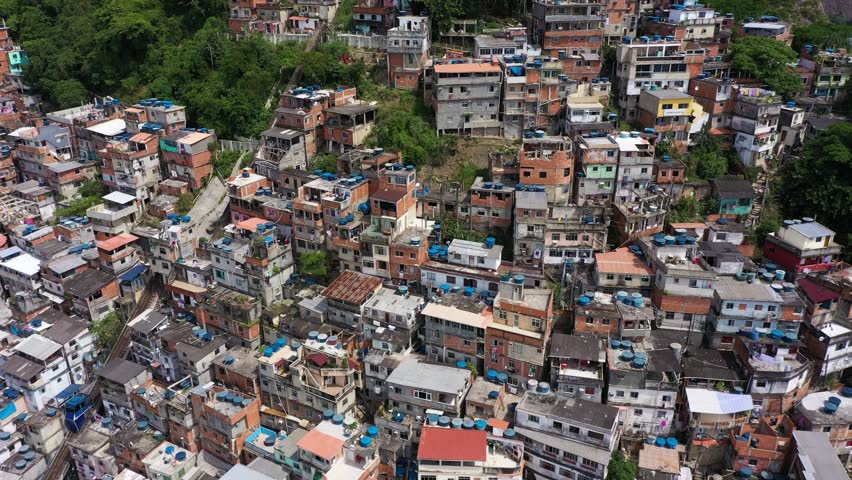 Cantagalo and Pavao-Pavaozinho Favelas. Rio de Janeiro, Brazil. Aerial View. Drone Flies Backwards and Upwards Royalty-Free Stock Footage #1098940747