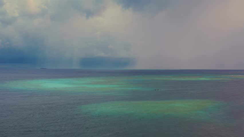 Stormy weather with rain on the sea. Before a powerful storm. Aerial view.
