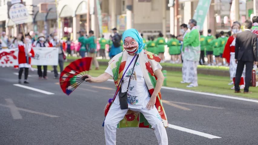 Japanese dancer with funny mask dancing in street with fan - Ohara Festival | Shutterstock HD Video #1098948569