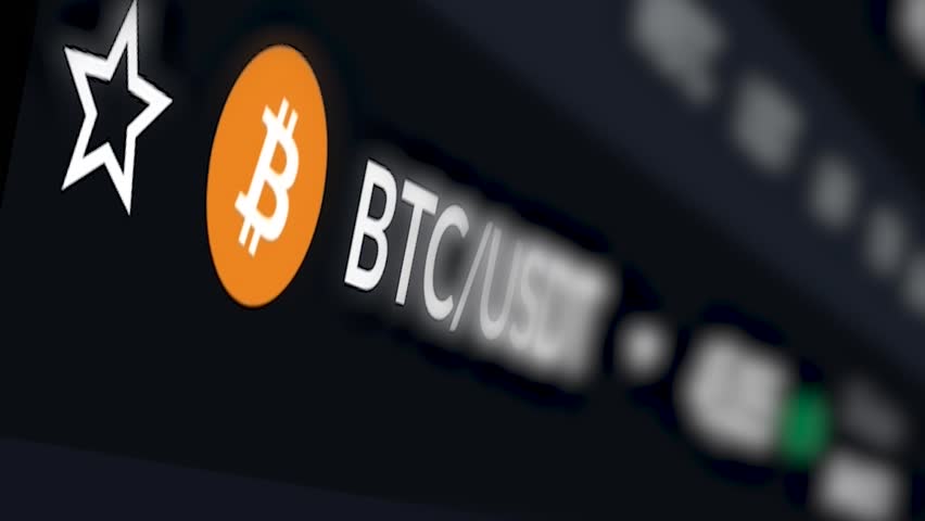 Bitcoin’s acronym and logo are shown on a computer screen