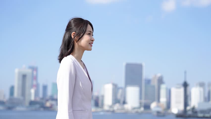 Businesswoman walking outside with a smile Royalty-Free Stock Footage #1098956485