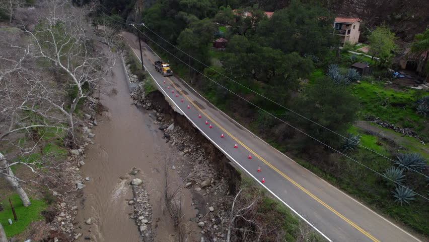 Broken Highway road damaged Destroyed Flooded River, Ojai, California, Ventura River disaster Rain Storm Aerial
