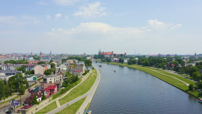 Inscription on video. Krakow, Poland. Flight over the city. Ships on the Vistula River. View of the historic center. Glitch effect text, Aerial View