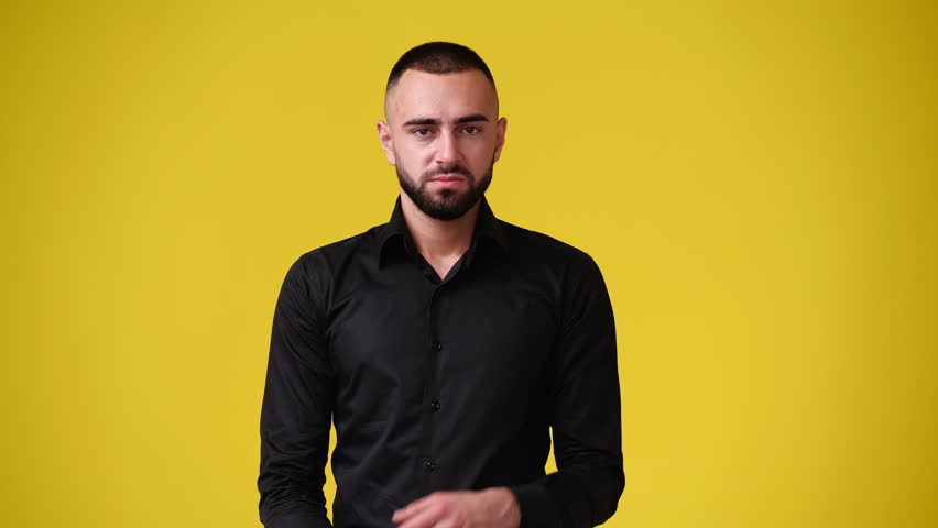 4k slow motion video of one man having headache over yellow background. | Shutterstock HD Video #1098964411