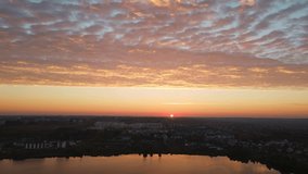 Sunrise with beautiful clouds in the city. Aerial shot