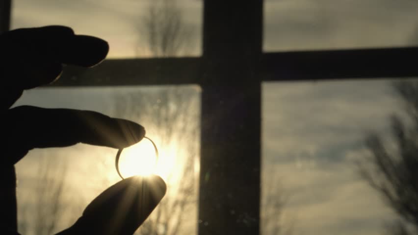 Human hand on background of sun. Backlight silhouette sunlight at sunset sunrise. The concept of love, dream, religion, faith in god, prayer, meditation. Christian Muslim raises his hands to the sky.