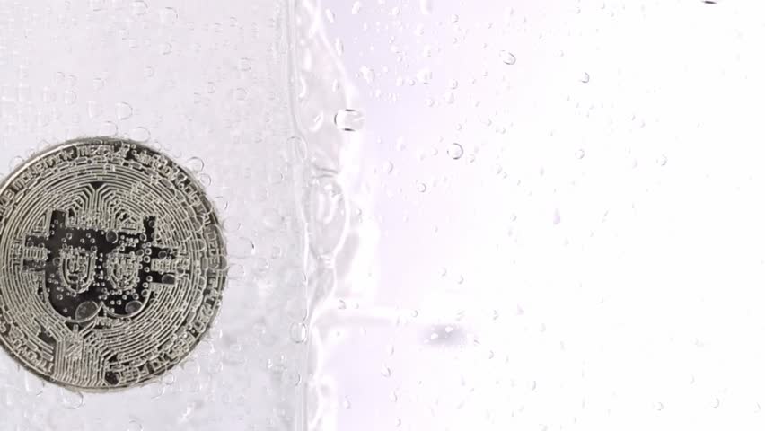 Bitcoin in the sparkling water. Slow motion | Shutterstock HD Video #1098967243