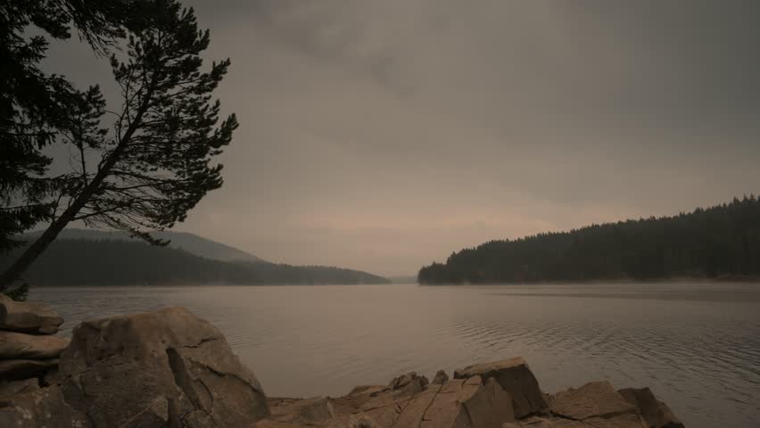 Fog over lake, early in the morning.