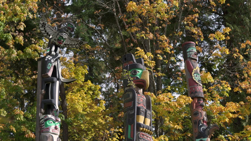Stanley Park Totem Poles in Autumn 4K UHD. Stanley Park totem poles with autumn leaves, Vancouver, British Columbia, Canada. 4K, UHD,
