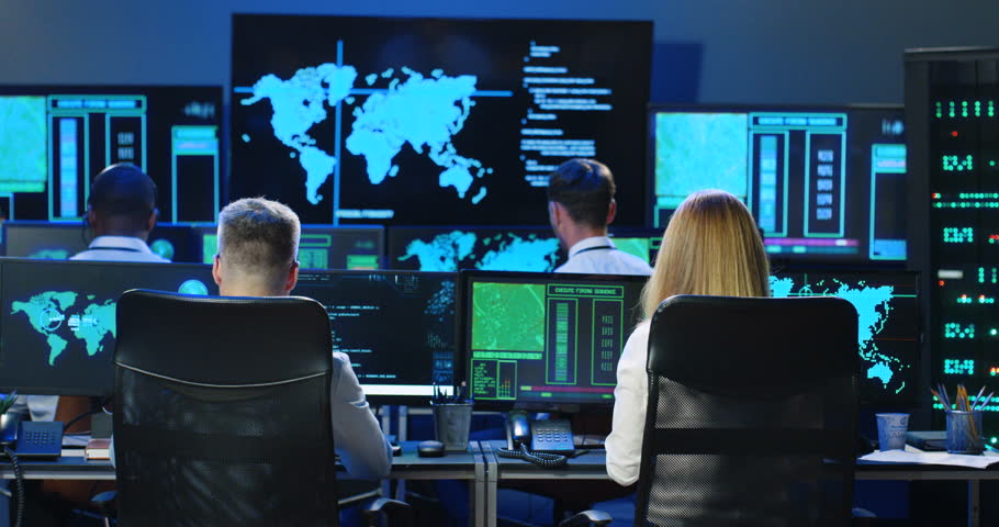 Rear of Caucasian male and female co-workers of digital analytic military center working at computers. Back view on man and woman, colleagues checking information in governmental anti-terrorism office Royalty-Free Stock Footage #1098981877