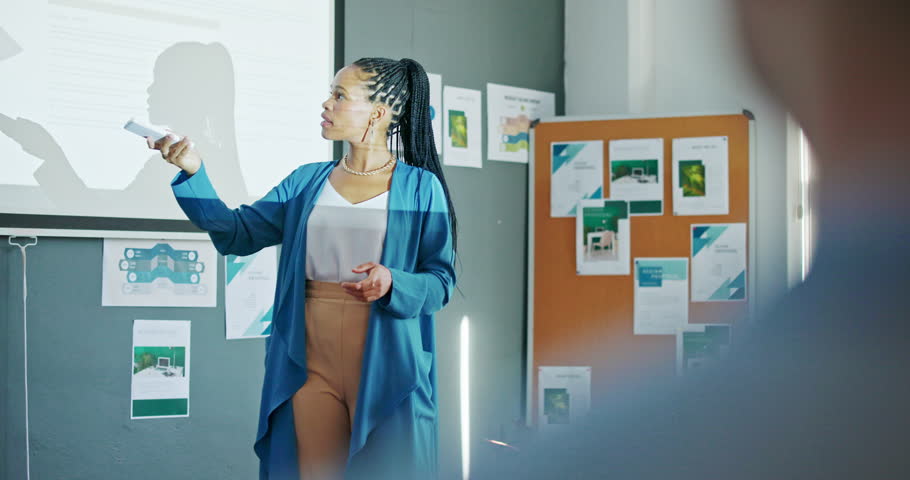 Presentation, workshop and lecture with woman coaching, teaching or speaking to audience of design strategy. Infographic, education and black woman professor on college, university or class projector Royalty-Free Stock Footage #1098987227