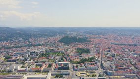 Inscription on video. Graz, Austria. The historic city center aerial view. Mount Schlossberg (Castle Hill). Text furry, Aerial View