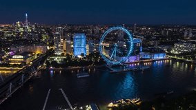 Establishing Aerial View Shot of London UK, United Kingdom, beautiful Southbank and London Eye and Shard at night evening