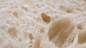 Macro Bread texture slider shot. Texture of baked porous bread close-up