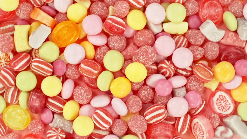 Super slow motion of flying candies up in the air. Camera in super fast motion. Filmed on high speed cinema camera, 1000 fps, placed on high speed cine bot.