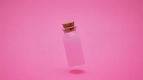 One bottle rotates on a red background. copy space - Powered by Shutterstock - Get 15% off with code: PIKWIZARD15