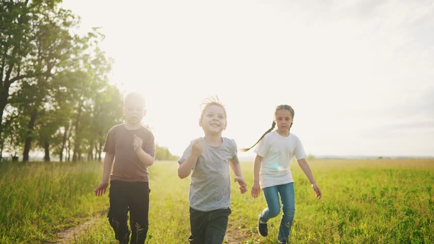 Group of children a run in the park. little children are happy running on lifestyle the grass in the summer playing in the forest. happy family kindergarten kids dream concept | Shutterstock HD Video #1098993069