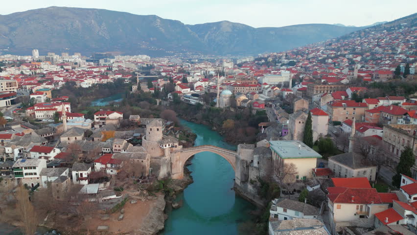 Mostar Bosnia and Herzegovina old bridge view fly over neretva river in old town. | Shutterstock HD Video #1099005193