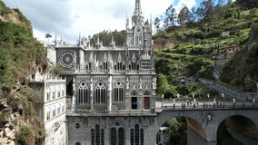 Drone video of the National Shrine Basilica of Our Lady of Las Lajas over the Guáitara River in Narino Department of Colombia in Ipiales, considered one of the most beautiful churches in the world