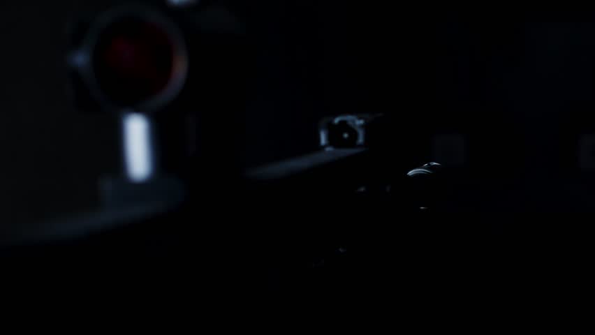 POV of AR-15 assault rifle firing in a dark room with smoke coming out of the muzzle