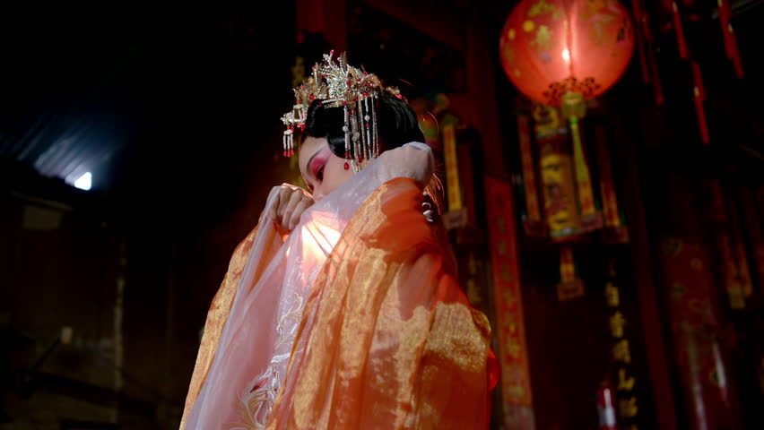 Chinese women perform a ritual dance for the annual Chinese New Year in a venerable shrine or temple