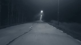 A trip on a rural forest road in a fog at night, flying drone video