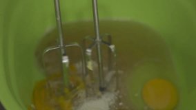 women are preparing cake mix, mixing eggs with sugar, trigu. to make cakes - b roll video HD 01