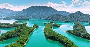 Aerial footage of Thousand Island Lake natural scenery in Hangzhou, Zhejiang Province, China. Green mountain and lake nature landscape in summer.